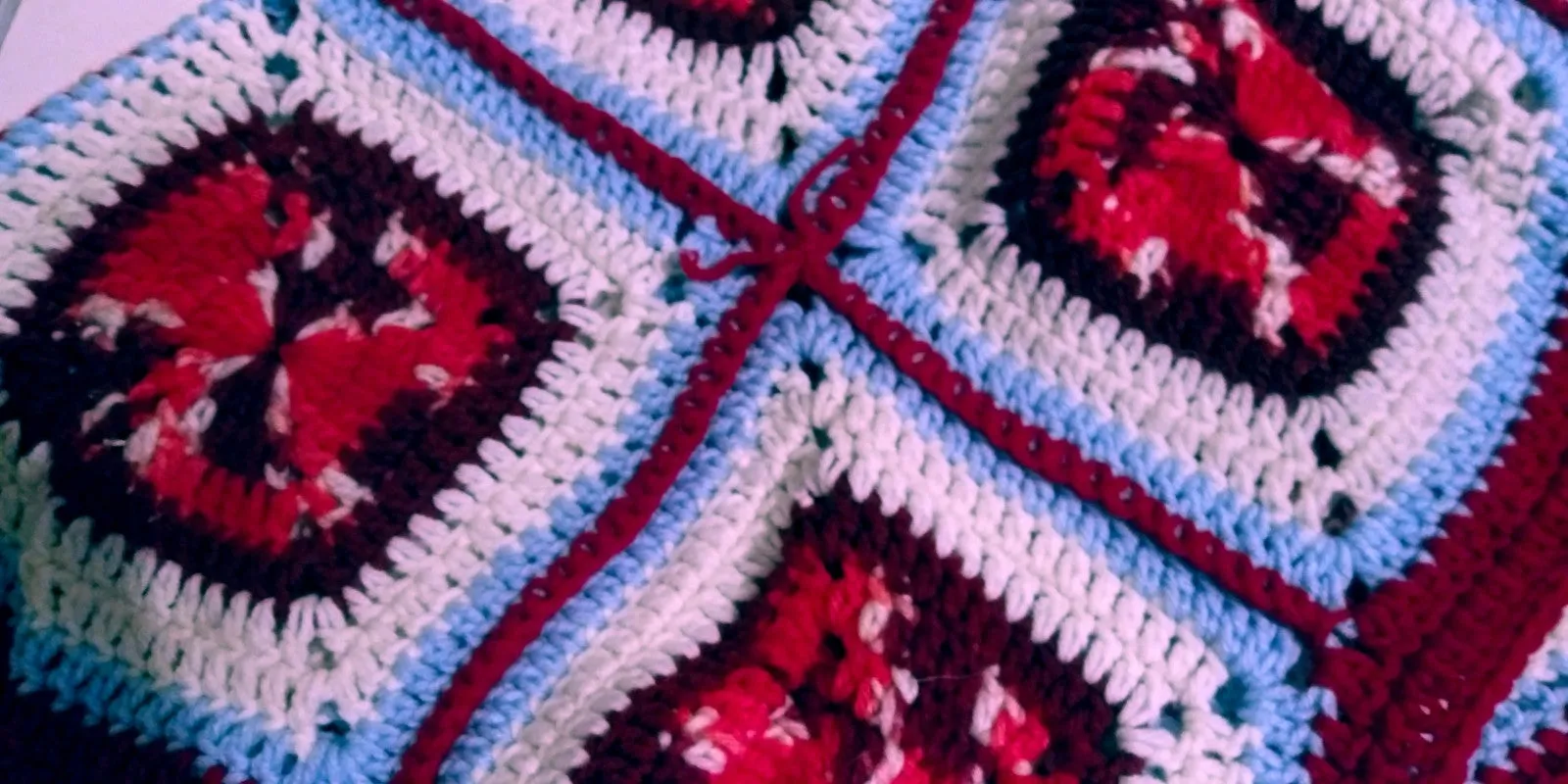 Handmade Granny Square hand crochet of Red, Whites, Light Blue and Red Border Baby Blanket